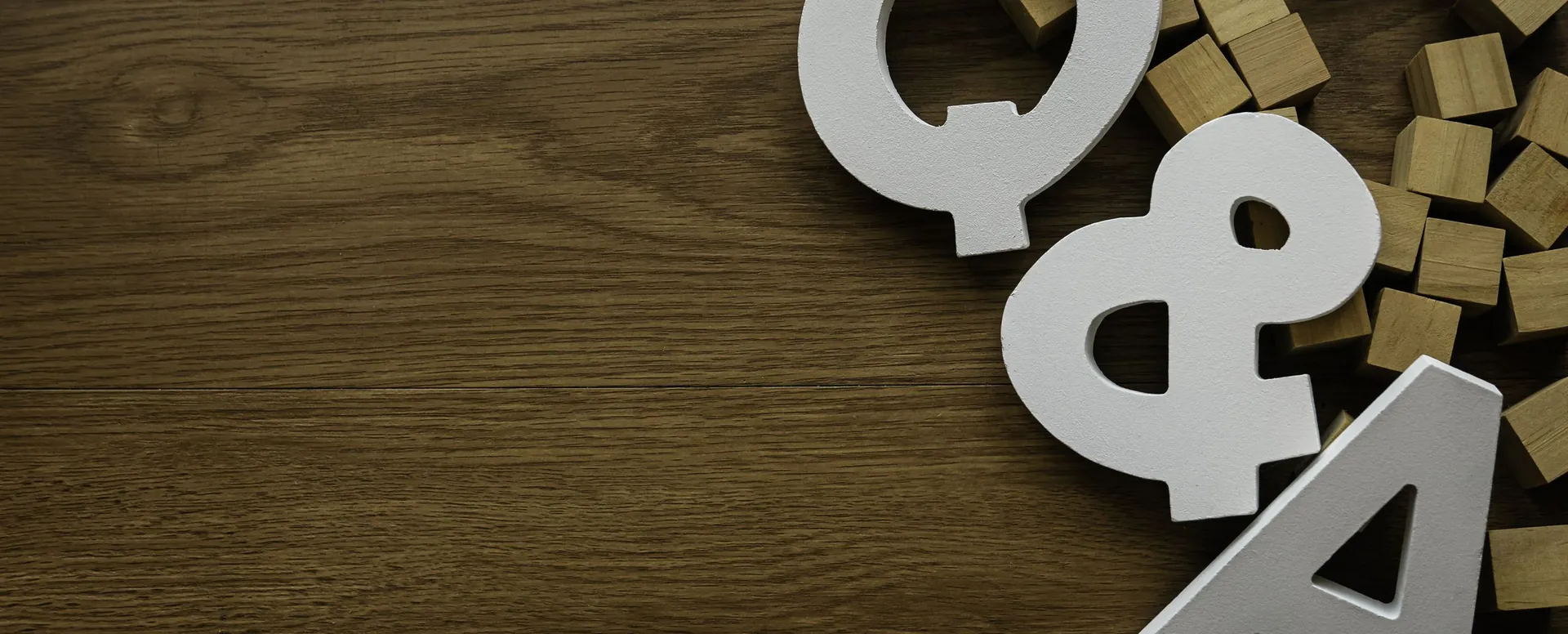 Wooden letters spelling Q and A